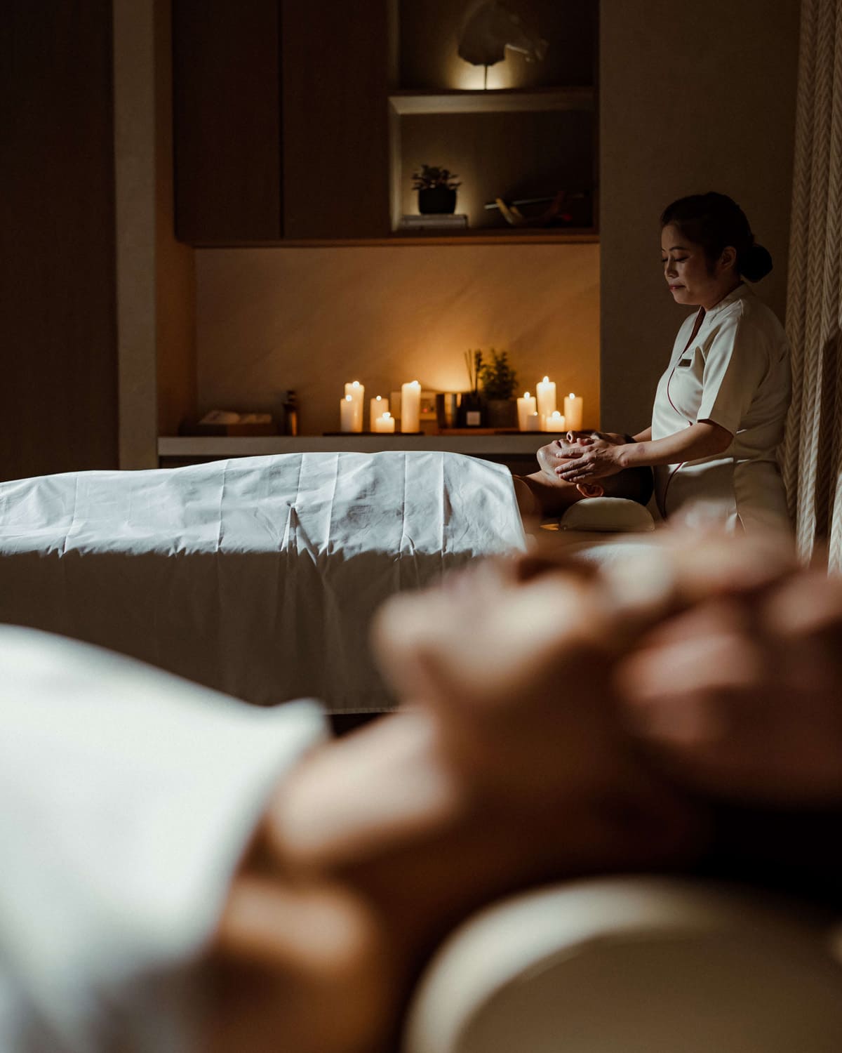 Couples getting spa facial massage.