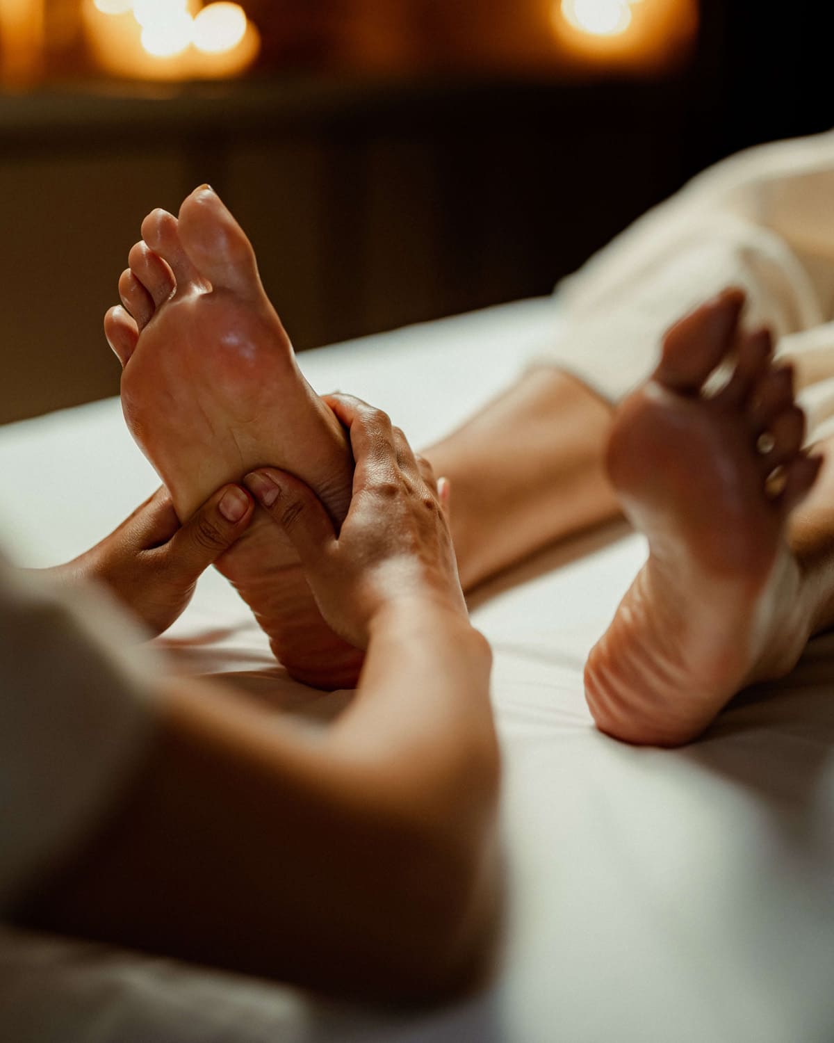 Foot massage therapy focused on deep tissue massage, relaxing massage, and holistic healing in a luxury spa setting