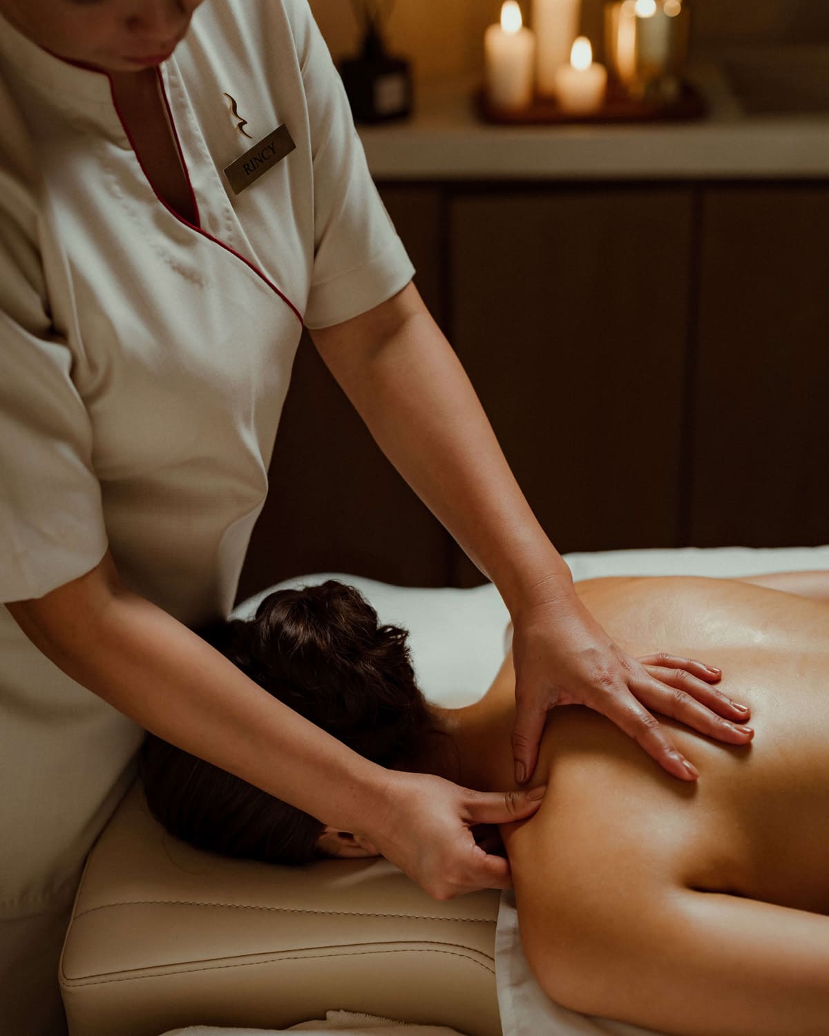 Women getting spa shoulder massage.
